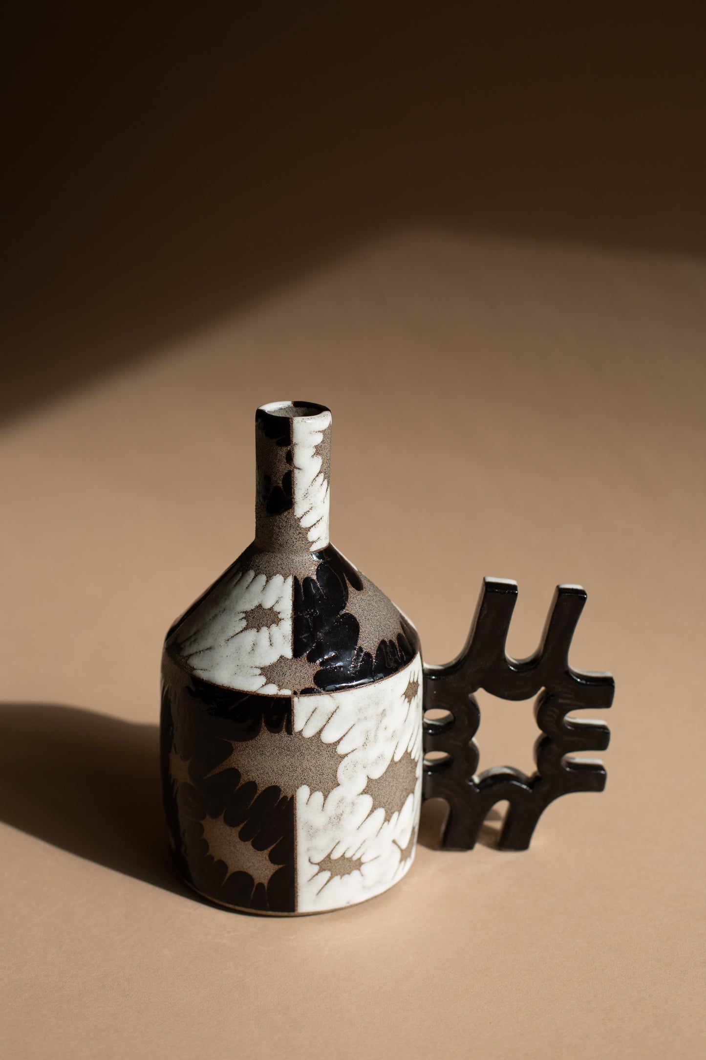 Spiky black + white oil-jug