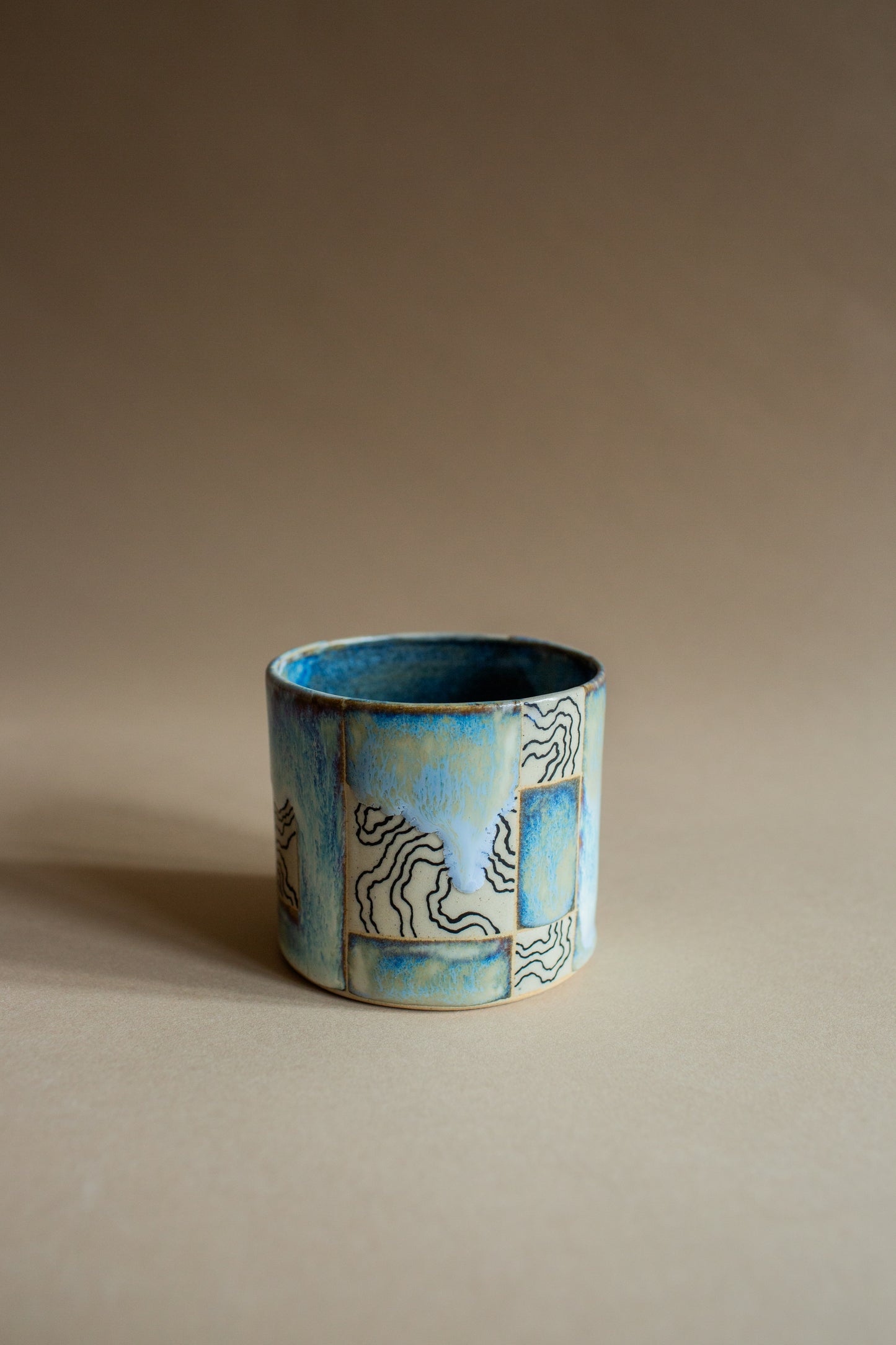 Ciao blue-green squiggly vessel