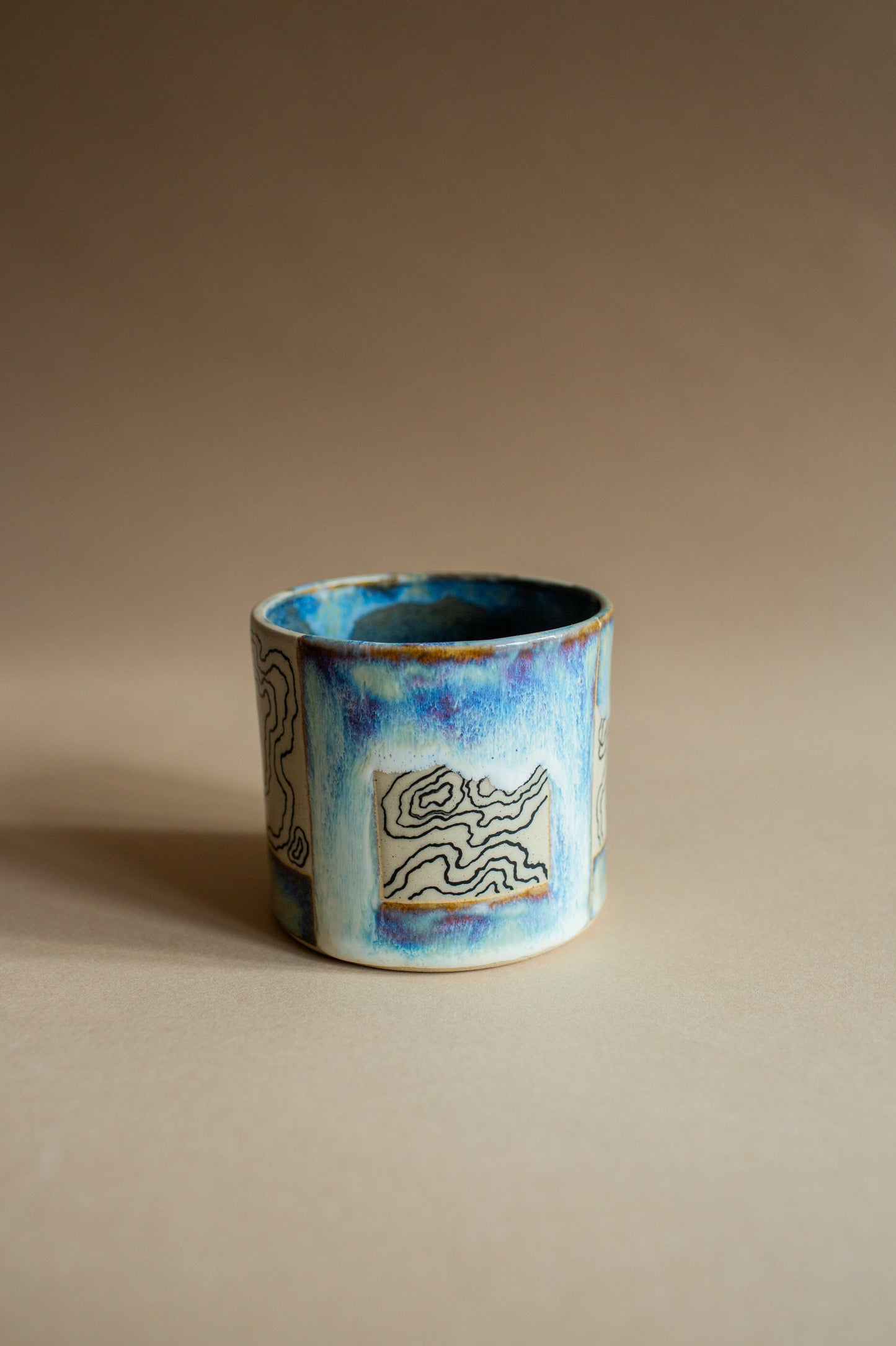 Ciao blue-green squiggly vessel