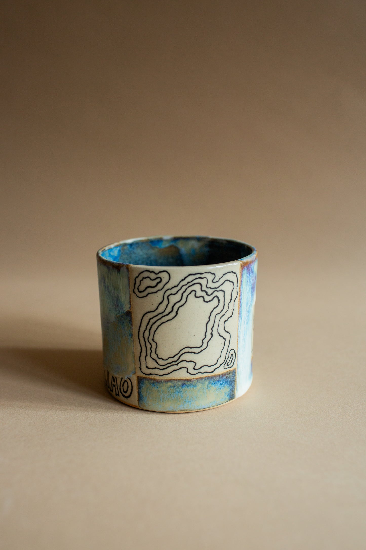 Ciao blue-green squiggly vessel