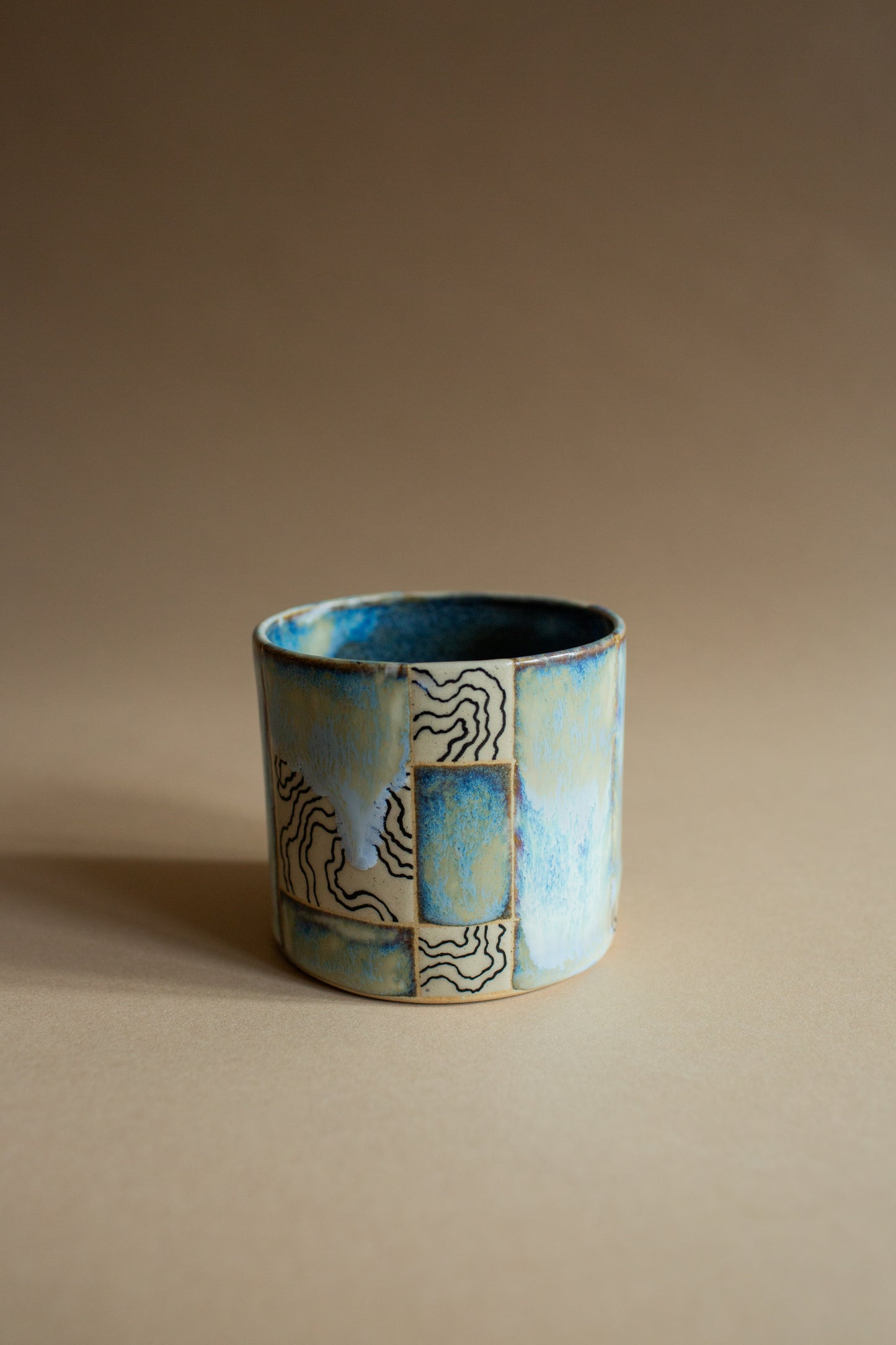 Ciao blue-green squiggly vessel