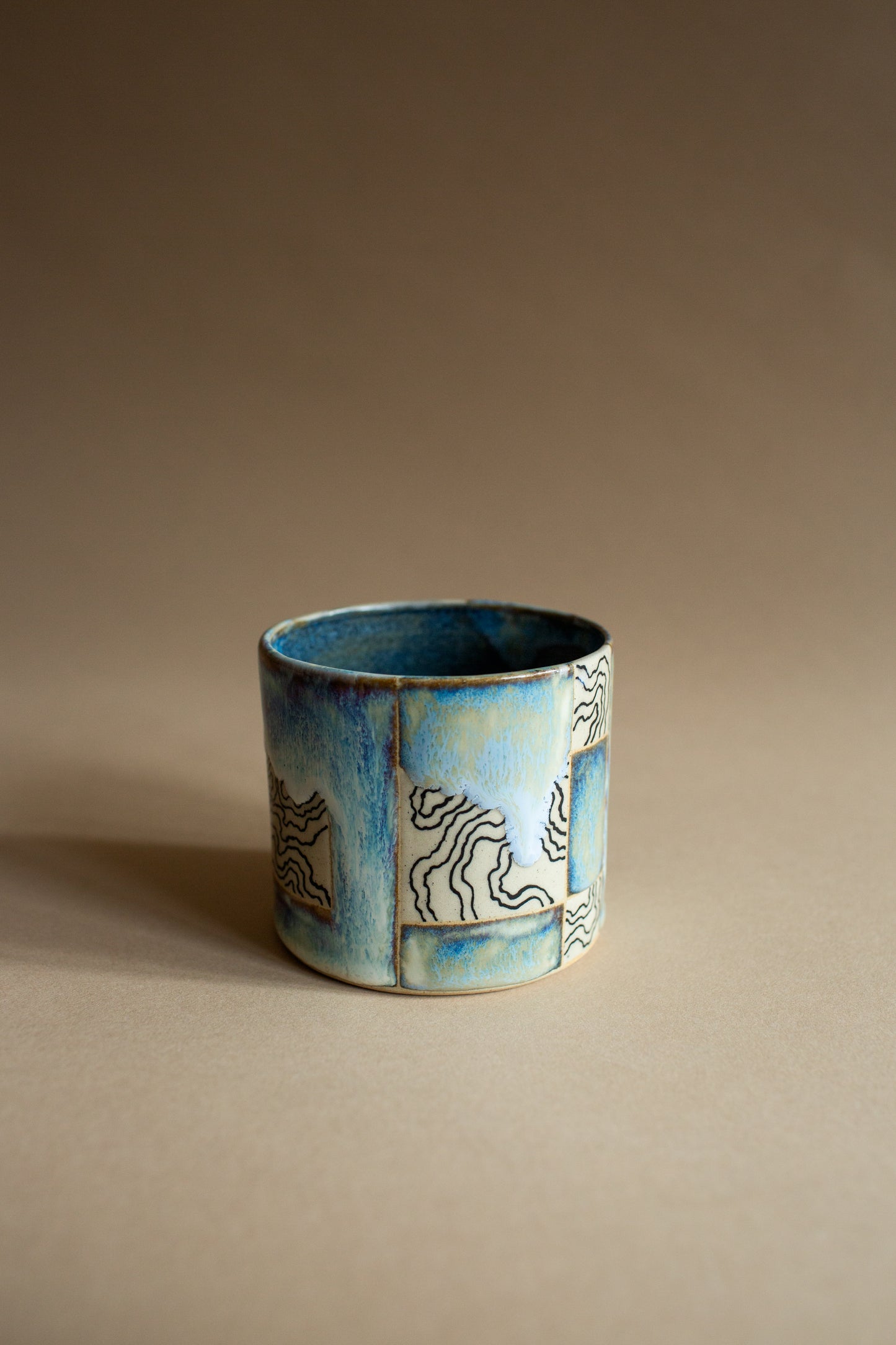 Ciao blue-green squiggly vessel