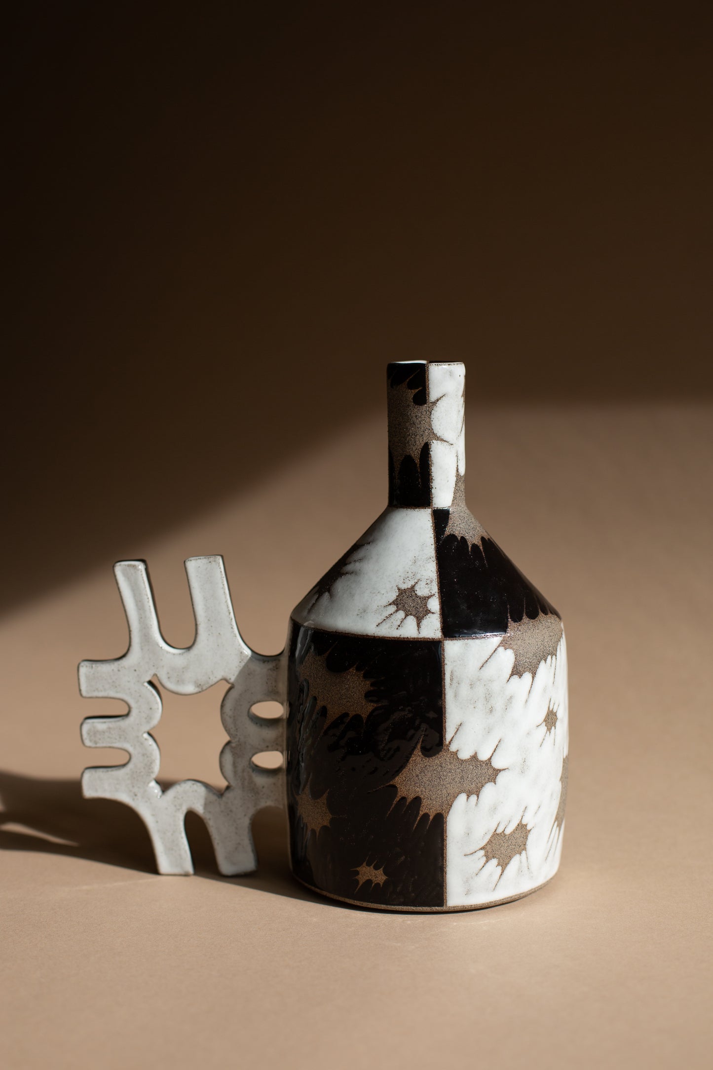 Spiky black + white oil-jug