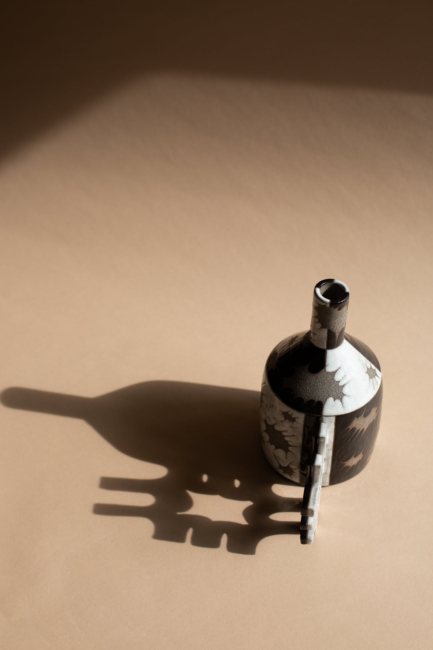 Spiky black + white oil-jug