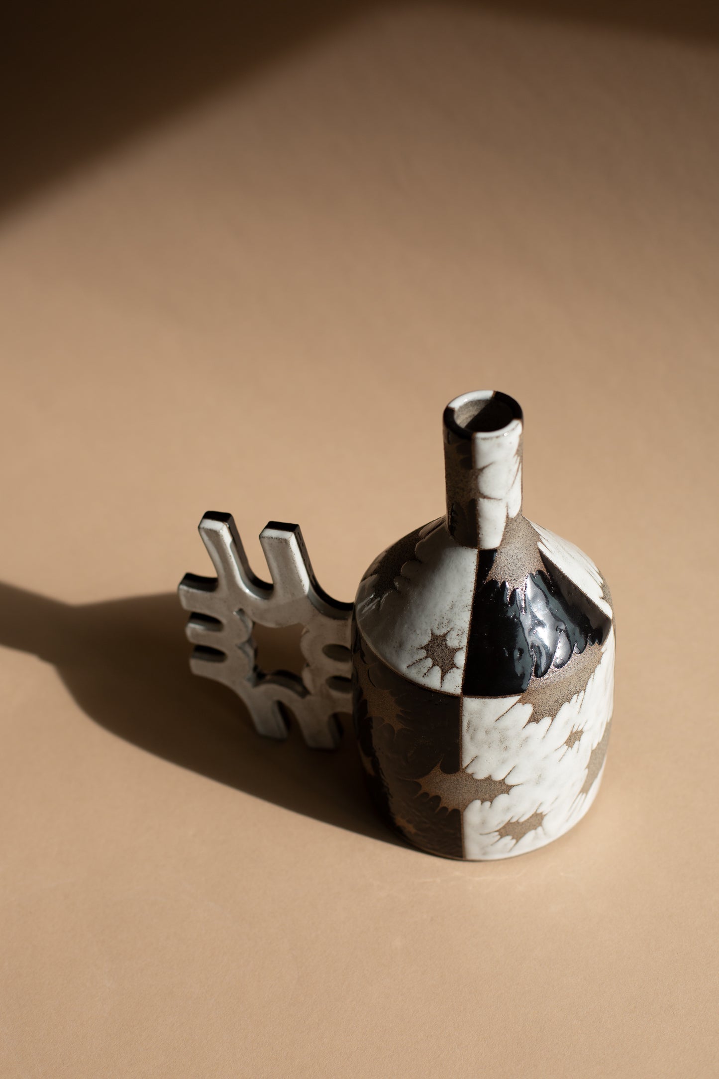 Spiky black + white oil-jug