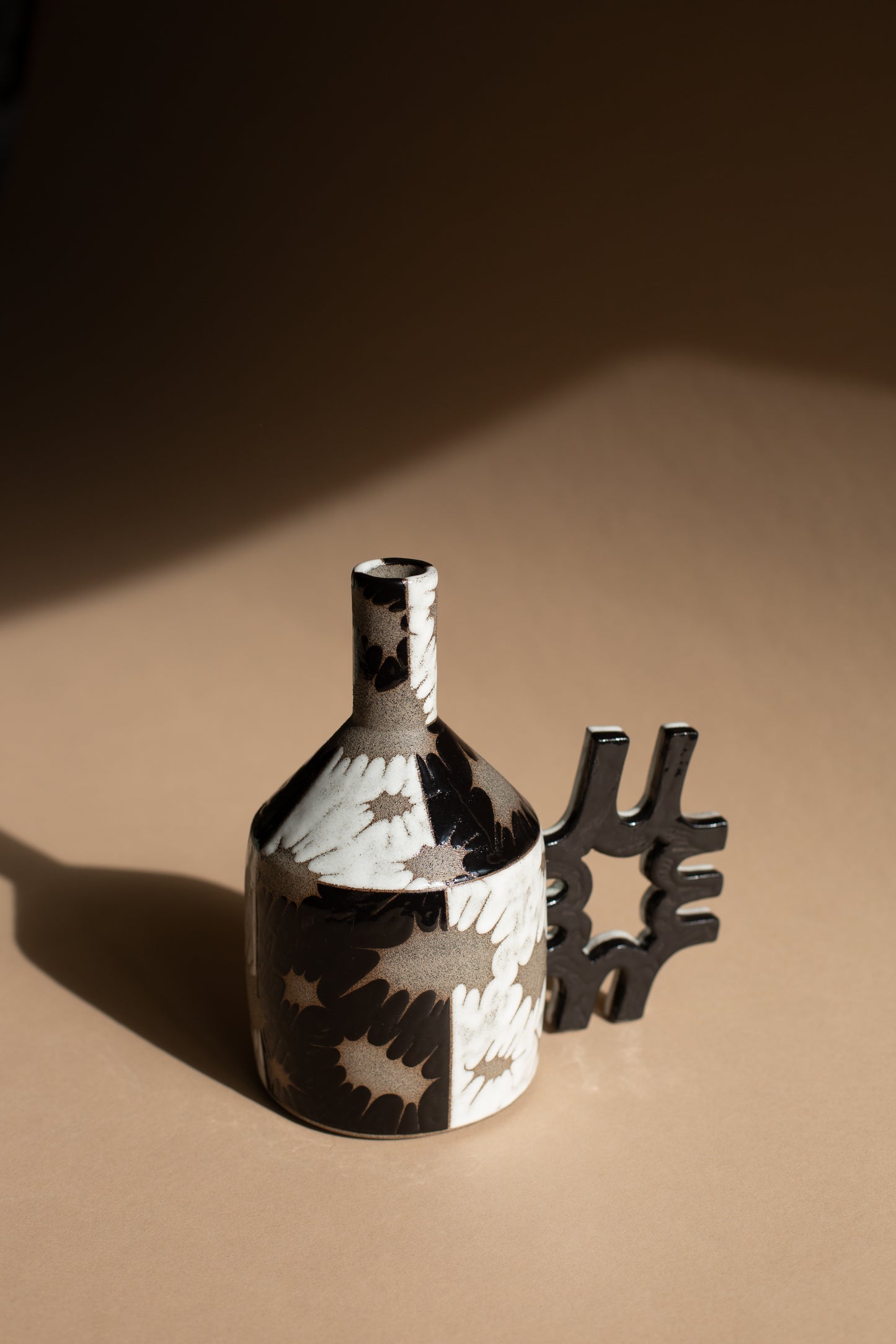 Spiky black + white oil-jug