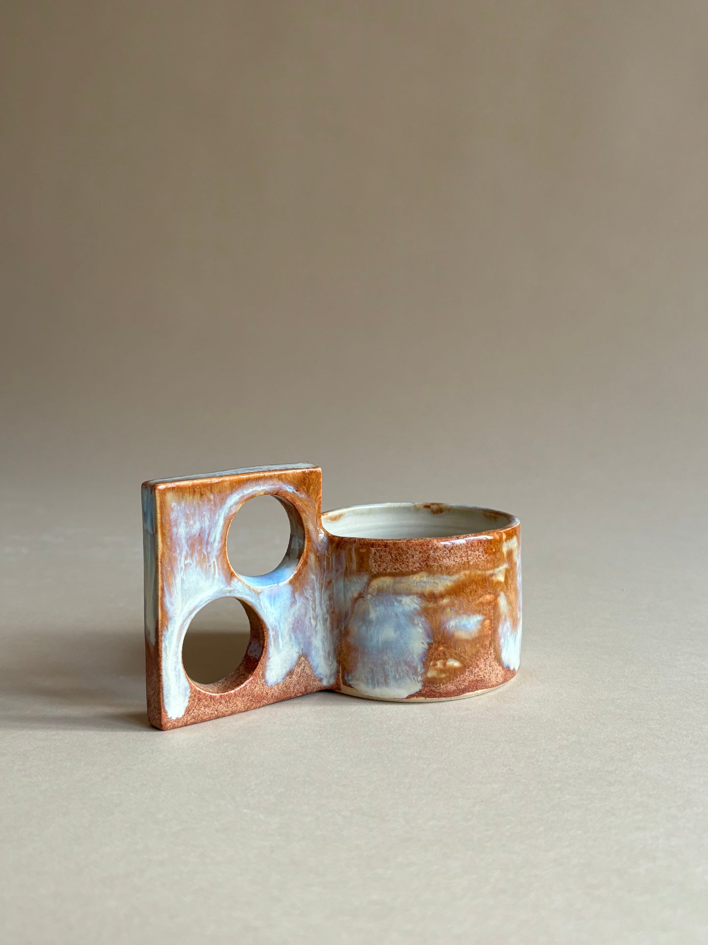 fiery mug with a funky double handle