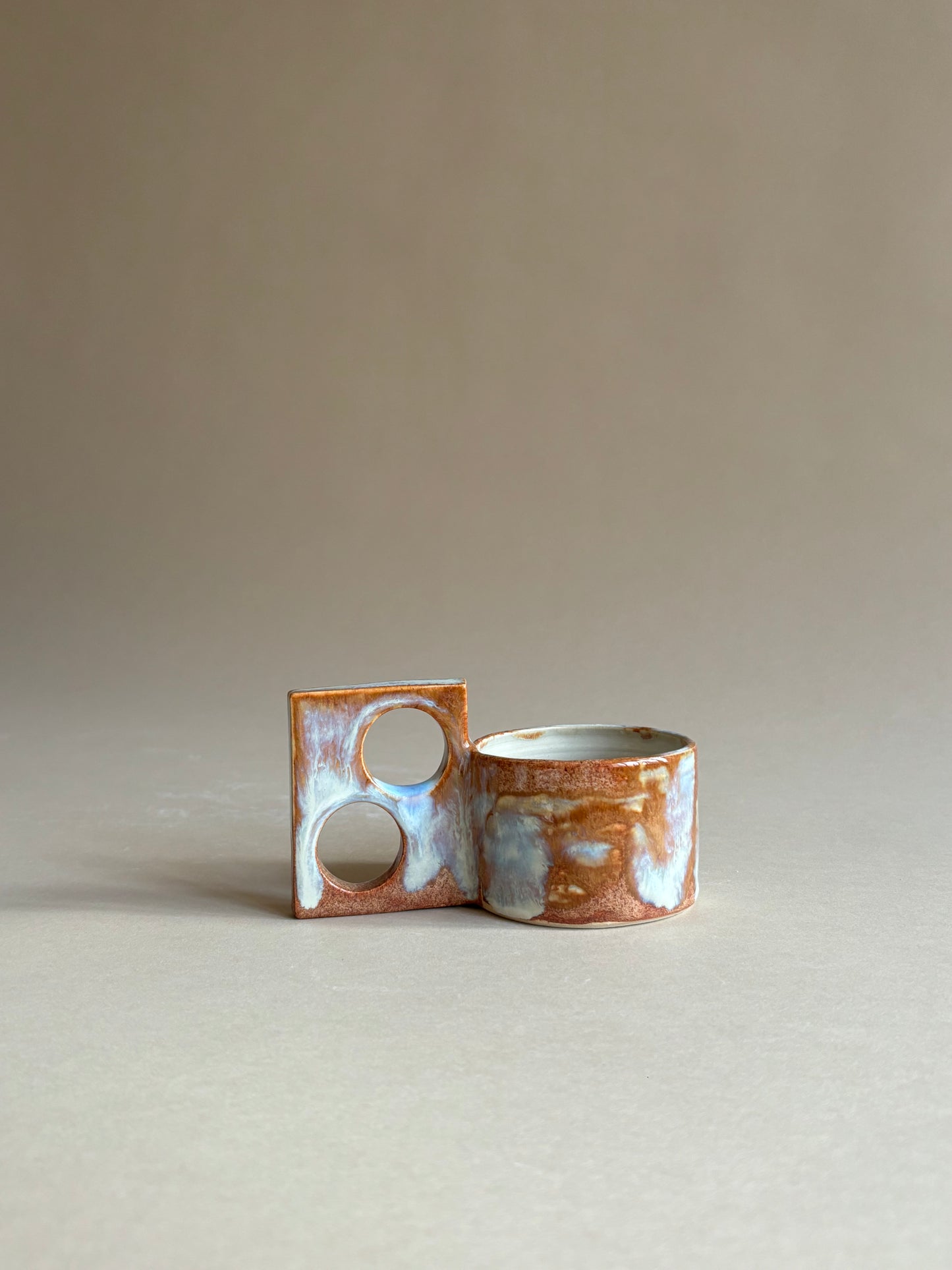 fiery mug with a funky double handle